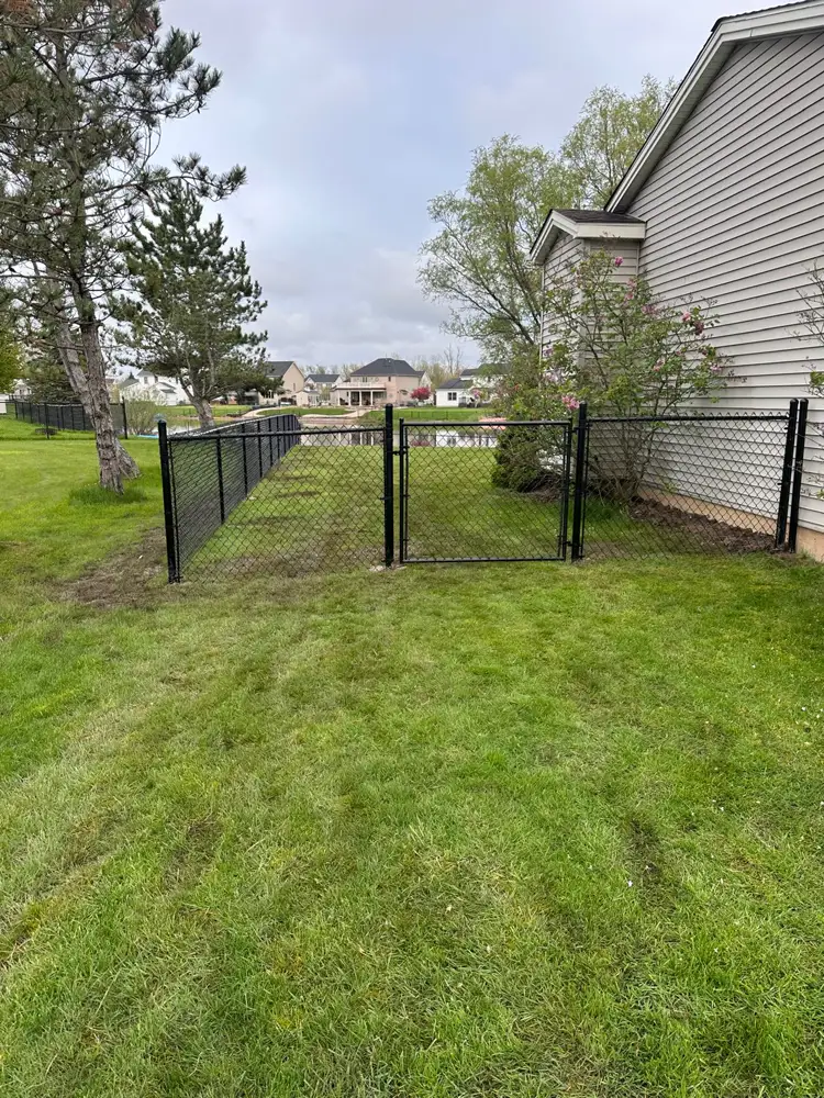 Chain link fence installation completed in a Rochester NY yard