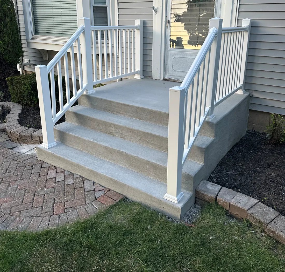 Custom deck stairs and white railing installed by KD Fence in Rochester NY